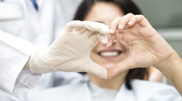Doctor and patient making heart