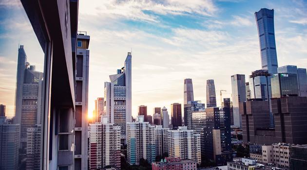 City buildings with sunset and clouds in the sky in Beijing