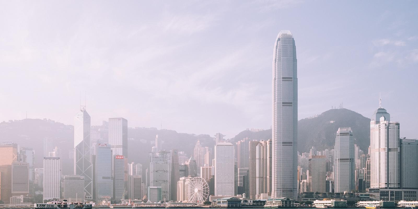 Skyline of Hong Kong with water with a boat in front