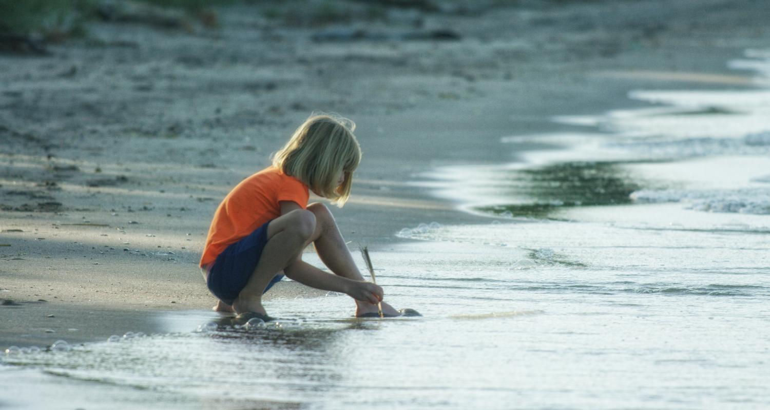 Child on a sandy beach